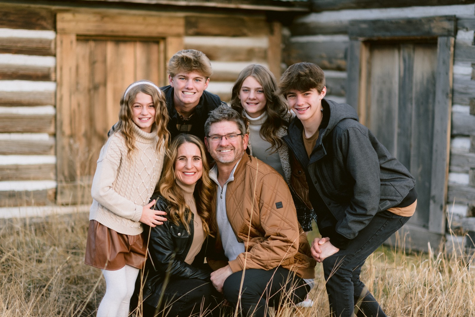 Family photo session at a rustic cabin in Steamboat Springs