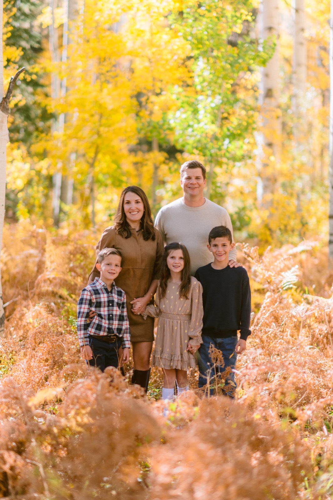 Family portrait in the fall aspens in Steamboat Springs Colorado