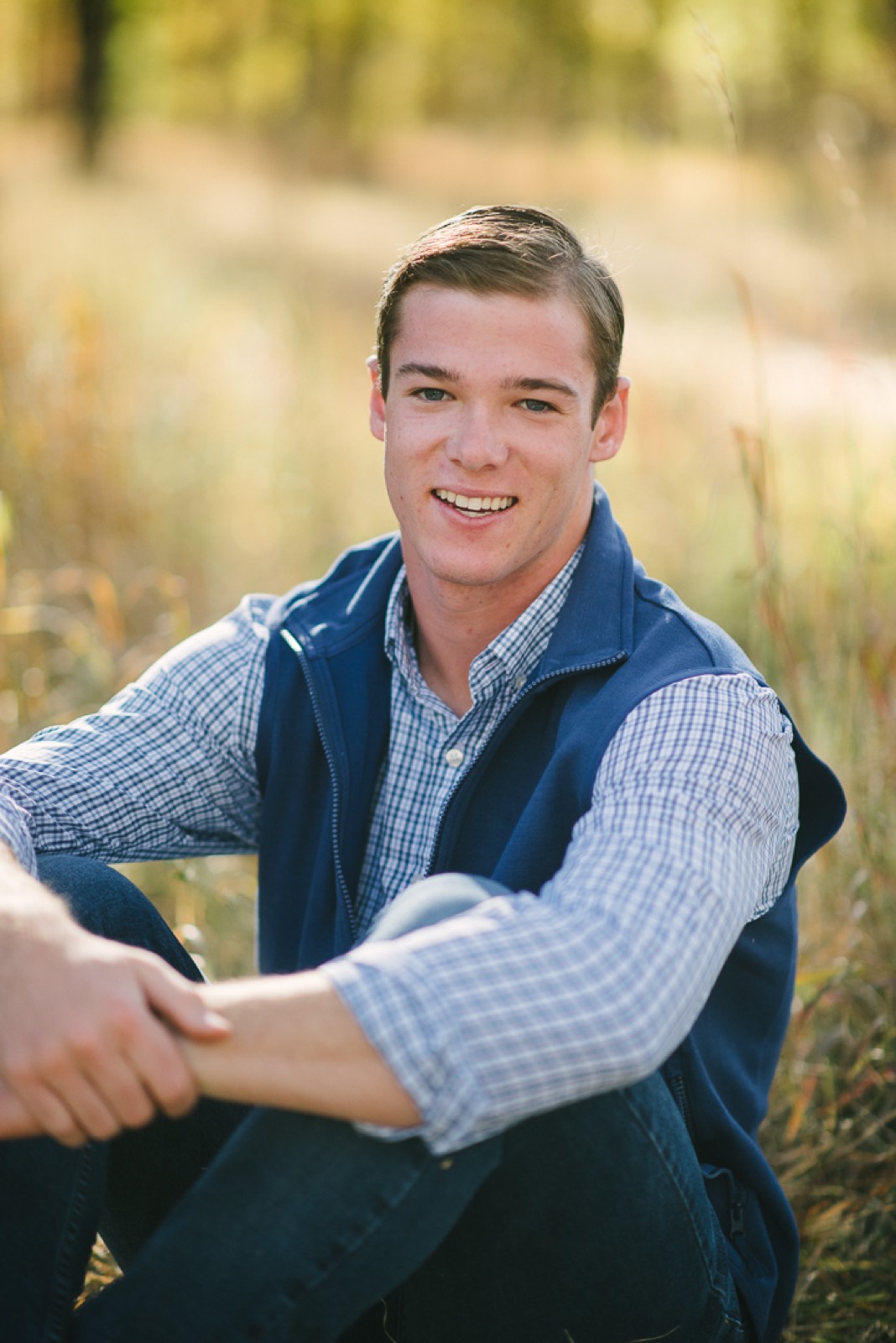 High school senior portrait in golden fall light near Steamboat Springs